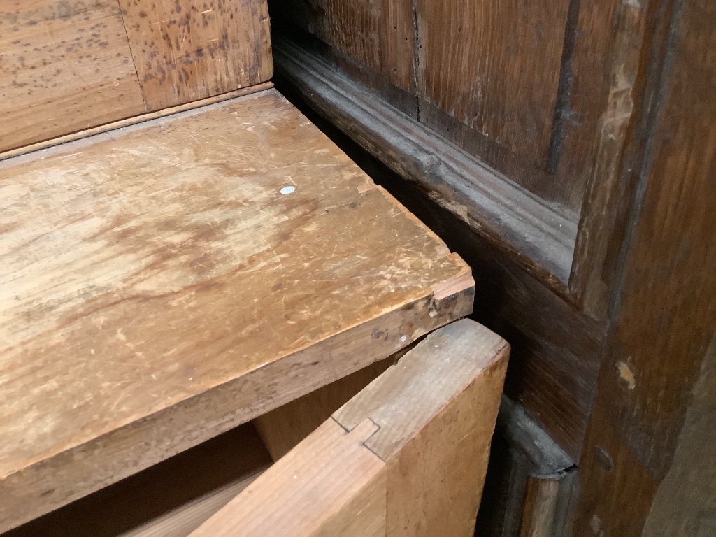 A glazed pine bookcase / cupboard, width 106cm, depth 46cm, height 196cm